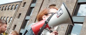 Woman holding a megaphone - POTS